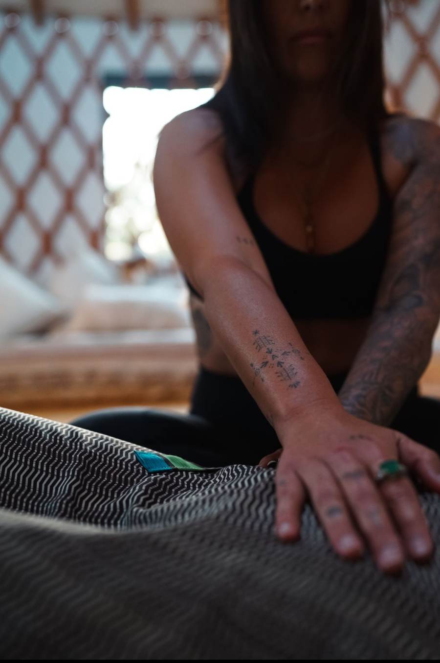 Sasha giving hands-on bodywork in the yurt